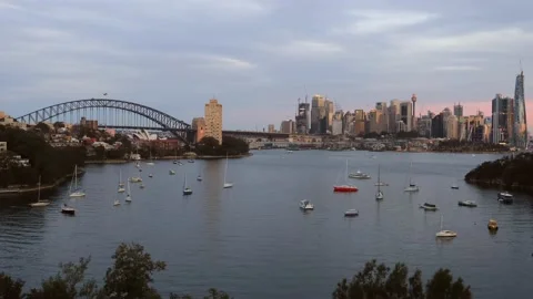 Dark time lapse over Sydney city and harbour at sunset with boats as 4k. Stock Footage 136516801
