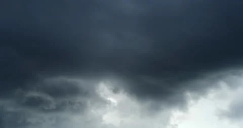 Dark time lapse roiling gray clouds, then wind changes direction Stock Footage 152525220