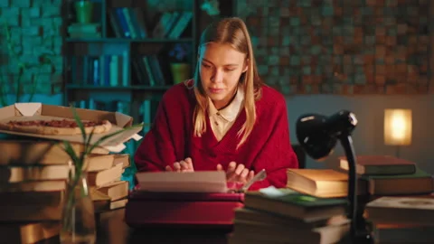 In the dark time of the night lady in the library studying doing her college Stock Footage 144210053
