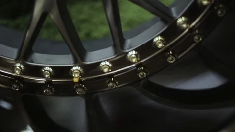 Dark Tire Rim with rivets close up Stock Footage 113338103