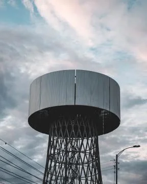 Dark tower on cloudy sky Stock Photos