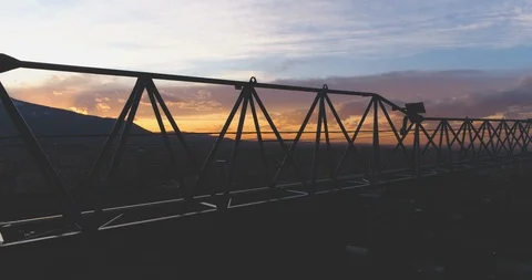Dark Tower crane arm silhouette against colorful sky Stock Footage 125606672