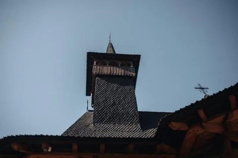Dark tower rises against clear blue sky Foto stock