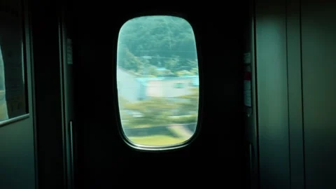 Dark train window with landscape rushing by Stock Footage 321748457