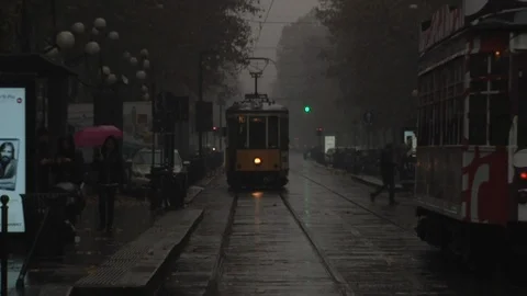 Dark tram in milan with rain Stock Footage 86130375