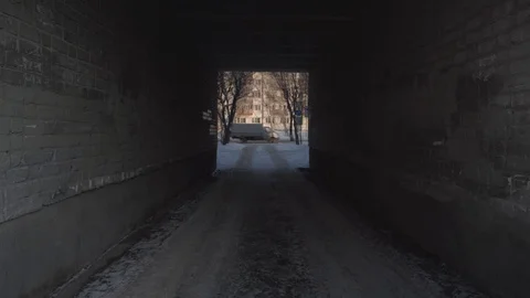 A dark tunnel of brick building Stock Footage 124358645