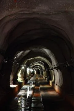 Dark tunnel with light Stock Photos
