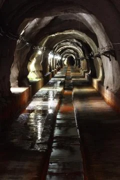 Dark tunnel with light Stock Photos