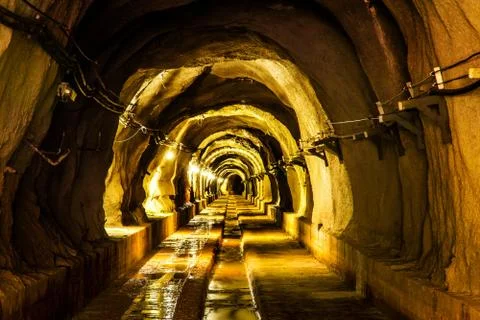 Dark tunnel with light Stock Photos