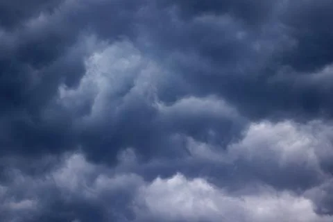 Dark turbulent storm clouds Stock Photos