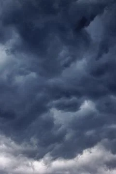 Dark turbulent storm clouds Stock Photos