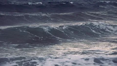 Dark turbulent waves of a choppy ocean under gloomy skies Stock Footage 337417636