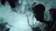 Dark Underwater Cannonball Silhouette In Slow Motion Stock Footage