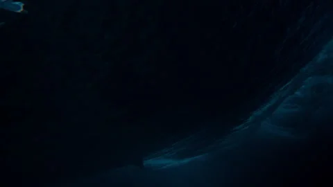 Dark underwater ocean gradient surfer turning off wave top slow motion Stock Footage 333446381