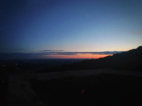 Dark Valley Landscape Under Deep Blue Sky 库存照片
