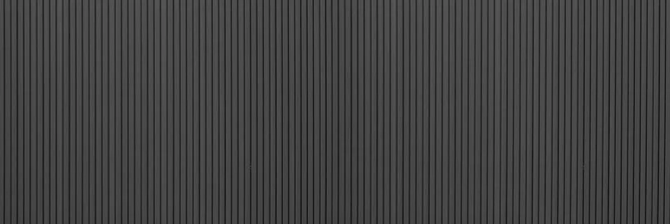 Dark vertical ribbed wall texture background Stock-Fotos