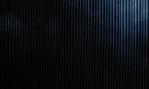 Dark vertical slat texture background with minimal corner light beam Stock Photos