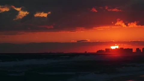 Dark vibrant red sunset in Santa Rosa Beach, Florida gulf of mexico Stock Footage 101981942