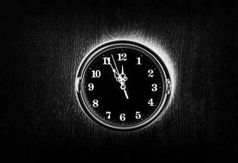 Dark vintage clock on the wall texture background Stock Photos