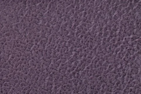 Dark violet fluffy background of soft, fleecy cloth. Texture of textile close Stock Photos