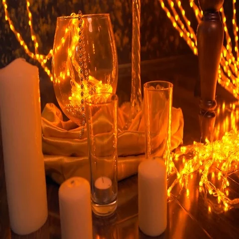 Dark wall and floor decorated with yellow christmas lights. Stock Footage 69563254