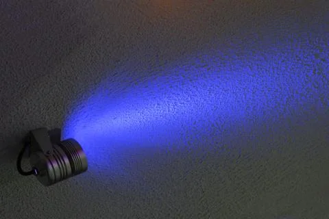 Dark wall illuminated colour floodlight Stock Photos