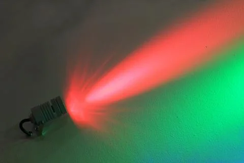 Dark wall illuminated colour floodlight Stock Photos