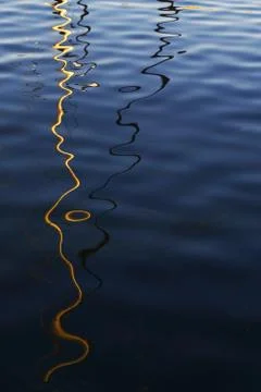 Dark water surface with reflections and soft waves Stock Photos