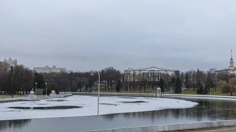Dark waters of the river with thin plates of ice. The first ice on the river  Stock Photos