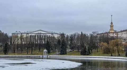 Dark waters of the river with thin plates of ice. The first ice on the river  Stock Photos