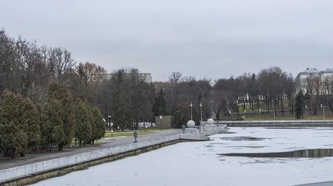 Dark waters of the river with thin plates of ice. The first ice on the river  Stock Photos