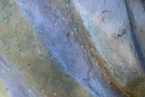 Dark wavy smooth stone surface with reflections and shadows Stock Photos