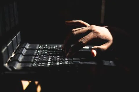 Dark web sites person using laptop computer and working at Indoor Dark Room.. 스톡 사진