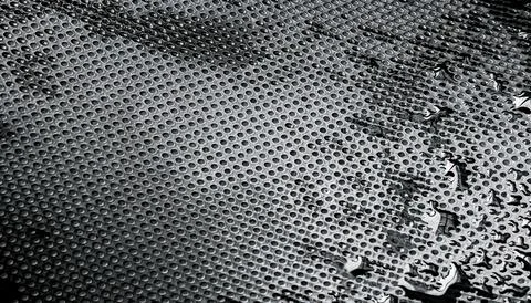 Dark Wet Surface Texture with Metallic Dotted Pattern Stock Photos