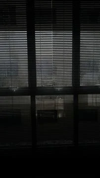 Dark Window Blinds with Light Filtering Through – Indoor View Foto stock