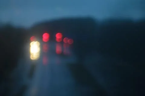 Dark window rain mood at dawn, bokeh lights 스톡 사진