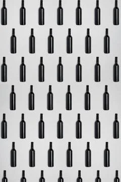 Dark wine bottles. Creative dark and textured abstract background. Stock Photos