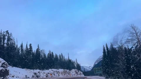 Dark winter highway in the mountains of Canada Stock Footage 342962244