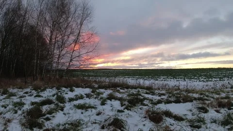 Dark winter sunrise and clouds above farmland, time lapse Stock Footage 260899803