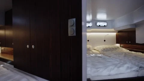Dark Wood Wardrobe and Double Berth in Cozy Yacht Cabin, Slow Dolly Shot Stock Footage 340336410