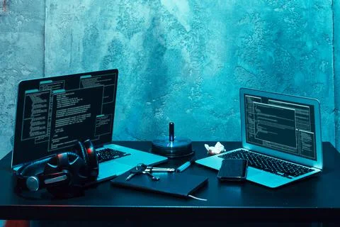 Dark working place of a programmer or hacker with computer 스톡 사진
