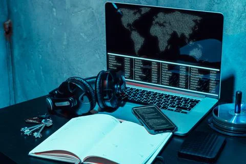 Dark working place of a programmer or hacker with computer Stock Photos