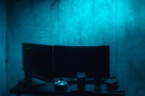 Dark working place of a programmer or hacker with computer Foto stock