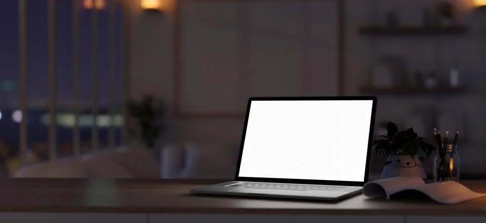 Dark workspace close-up image with a white-screen laptop computer on a desk.. Stock Illustration