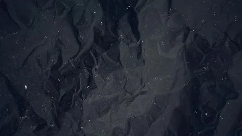 Dark Wrinkled Paper Texture Background with Floating Dust Noise, Subtle Film Stock Footage 336925636