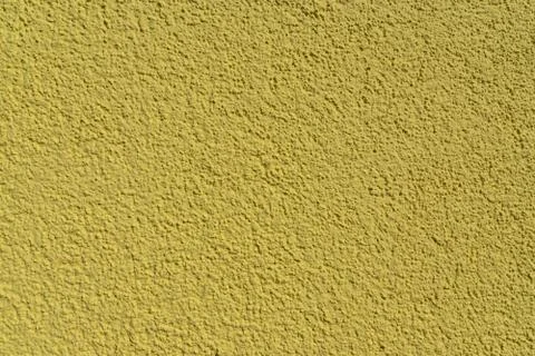 Dark yellow cement wall with structure Stock-Fotos