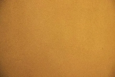 The dark yellow flat background material is a concrete wall texture Foto stock