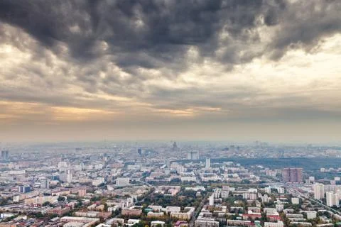 Dark yellow gray clouds under autumn moscow Stock Photos