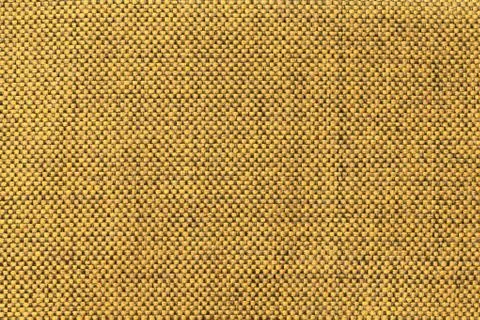 Dark yellow textile background with chess pattern, closeup. Structure of the  Stock Photos