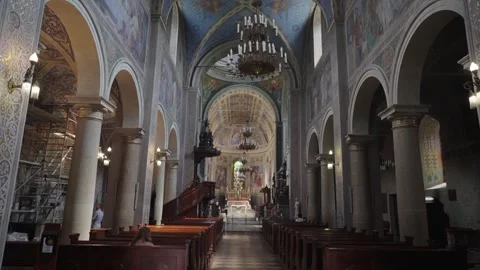 Dark yet beautiful interior of Plock Cathedral with arched ceilings Видео 331502236
